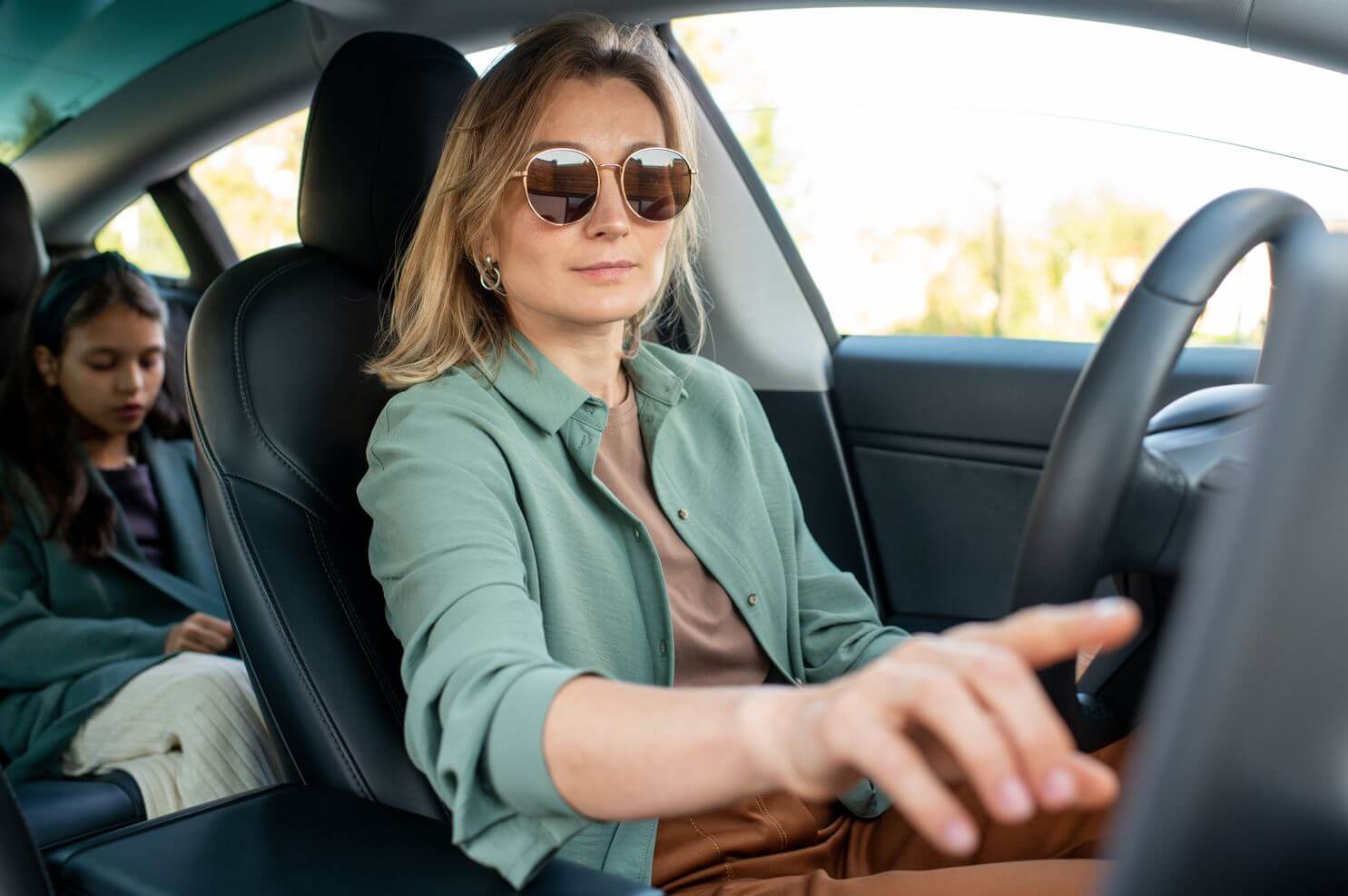 women driving a car