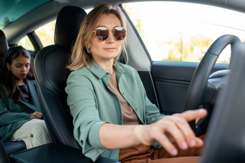 women driving a car