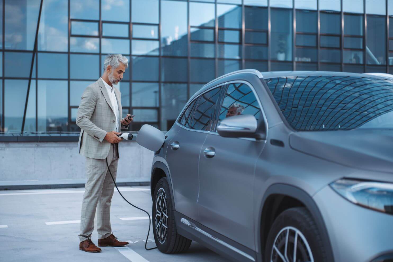 a man charging his car