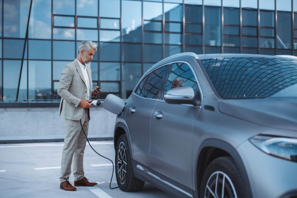 a man charging his car